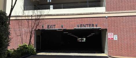 A building entrance with a sign indicating an exit and an entrance.