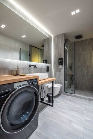 Shower, hair dryer, towels, soap