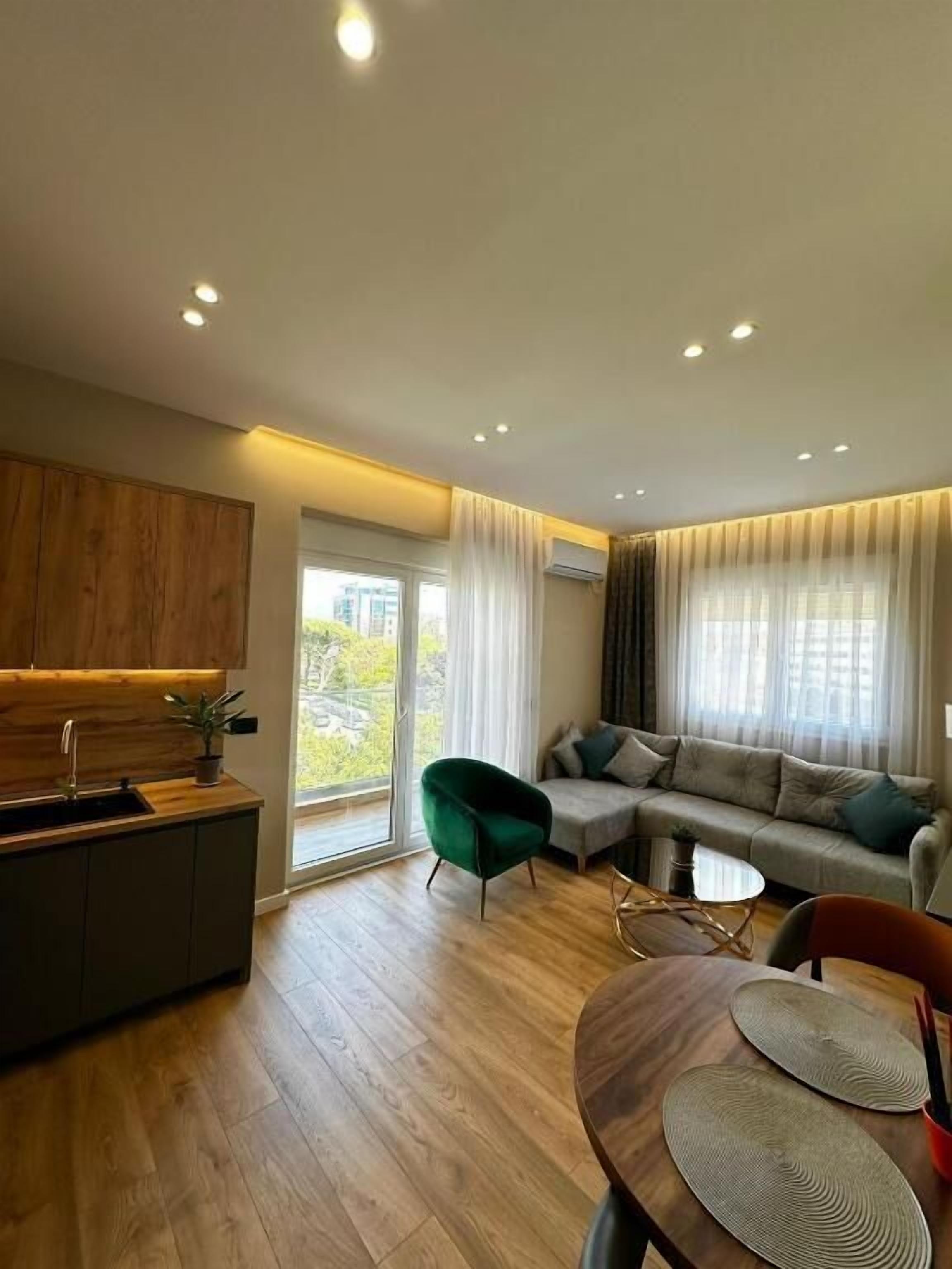 Comfort Apartment, Balcony, City View | Living room | Flat-screen TV