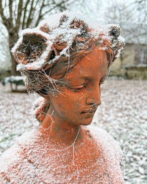 A sculpture with a textured surface, possibly made of clay or stone, with intricate details and a rough texture. - Welcome to the castle! Authenticity, charm, and absolute tranquility.   (Machemont)
