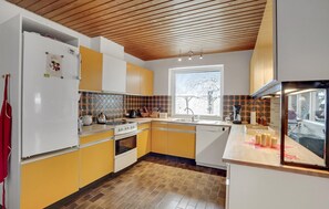 Fridge, stovetop, dishwasher, coffee/tea maker