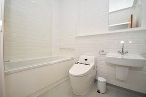 Shower, hair dryer, towels, shampoo