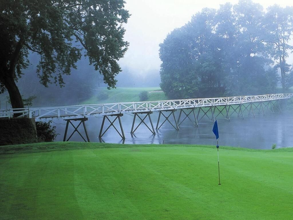 Arrive to sweeping resort views framed by lush green fairways.