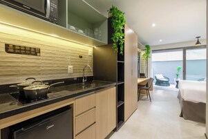 Grand Room, 1 King Bed, Kitchenette | Private kitchen | Microwave, stovetop, espresso maker, coffee/tea maker