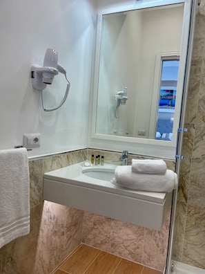 Hair dryer, towels, soap, shampoo