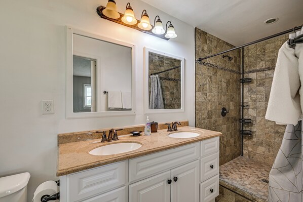 A bathroom with two sinks, a mirror, a shower with a glass door, and a towel hanging on a rack. - Golf Course Views & Games Galore - Vine Grove Gem! (Vine Grove)