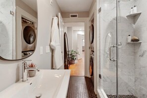 Shower, hair dryer, towels, shampoo