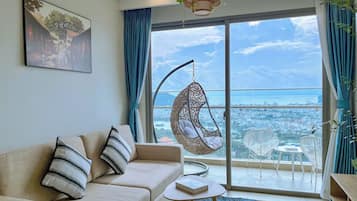 Apartment, 1 Bedroom, City View | Living area | 55-inch flat-screen TV with cable channels