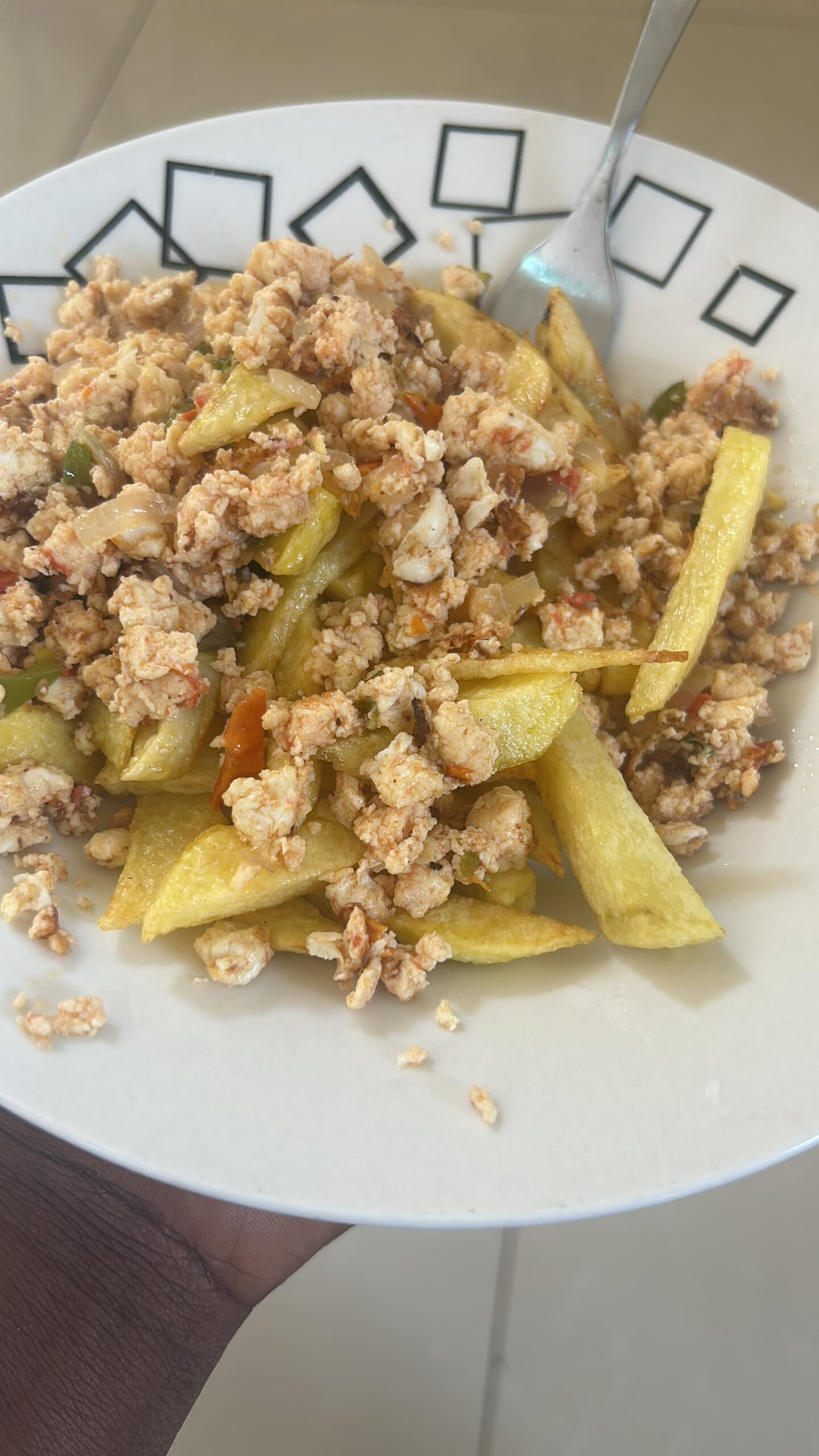A plate of food with fried potatoes and ground meat.