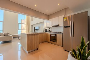 Fridge, microwave, cookware/dishes/utensils