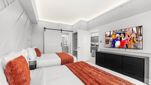 A modern hotel room with two beds, a flat-screen TV, and a kitchenette. - Near Disney, Universal, Outlets & OCCC (Orlando)