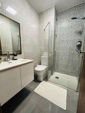 Shower, hair dryer, towels, soap