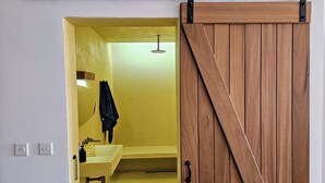 A bathroom with a sink, mirror, and towel rack. - GOZO APARTMENT (Qala)