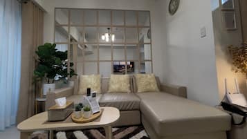 Condo, Balcony, City View | Living area | 55-inch Smart TV with cable channels, Netflix, streaming services