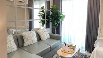 Comfort Studio Suite, Balcony | Living area | 55-inch Smart TV with cable channels, Netflix, streaming services
