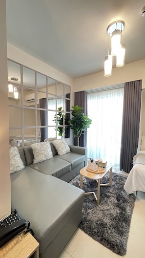 Comfort Studio Suite, Balcony | Living area | 55-inch Smart TV with cable channels, Netflix, streaming services