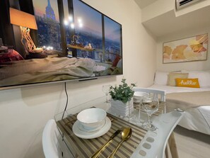 Desk, laptop workspace, blackout drapes, iron/ironing board