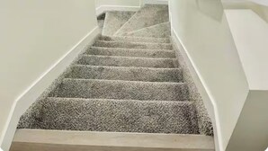 A staircase with carpeted steps leading to a landing. - Stylish One Bedroom Cozy Home (Edmonton)