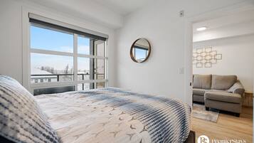 1 bedroom, desk, iron/ironing board, travel crib