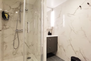 Shower, hair dryer, towels, soap