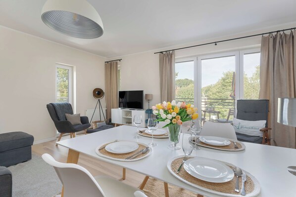 Large dining table with elegant tableware.