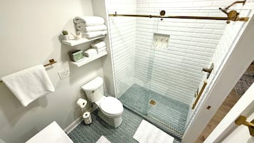 Shower, hair dryer, towels, soap