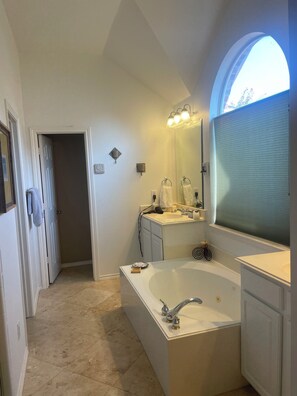Jetted tub, hair dryer, towels, soap