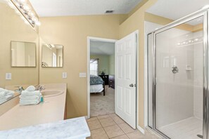Shower, hair dryer, towels, shampoo