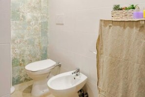 Hair dryer, towels, soap, toilet paper