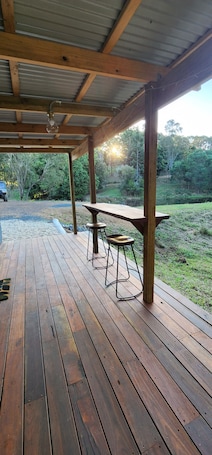 Outdoor dining. Little Soho – A Soulful Off-Grid Caravan Retreat