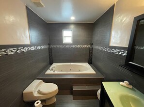 Shower, jetted tub, hair dryer, towels
