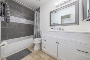 Shower, hair dryer, towels, toilet paper