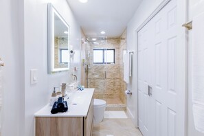 Shower, hair dryer, towels, soap