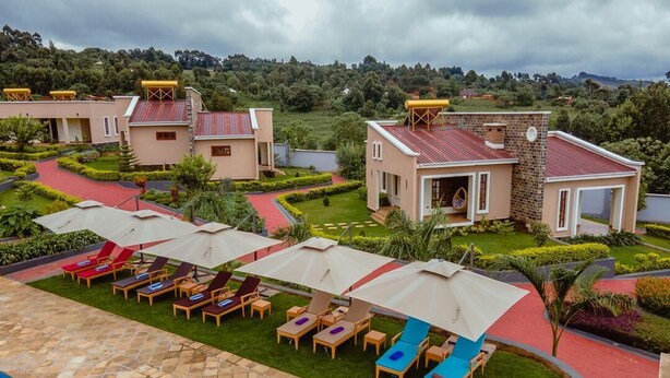 A resort with multiple buildings, a swimming pool, and outdoor seating areas. - INOGA LODGE KARATU (Karatu)