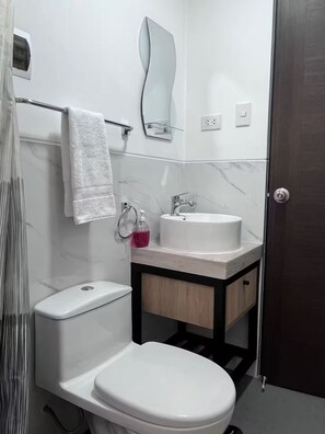 Hair dryer, towels, soap, toilet paper