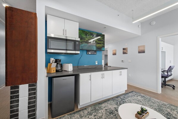 Fridge, microwave, coffee/tea maker, toaster