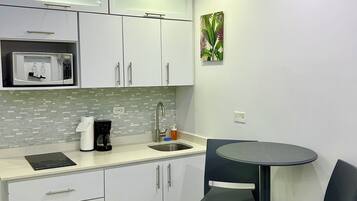 Fridge, microwave, stovetop, coffee/tea maker