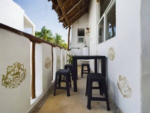 Apartment, 1 Bedroom, Accessible, Balcony | Outdoor dining - Chic 1BR With Pool & Parking Close to ADO (Playa del Carmen)
