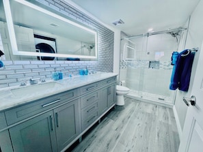 Shower, hair dryer, towels, soap