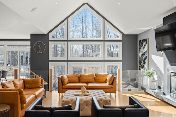 Open great room beneath two-storey cathedral windows