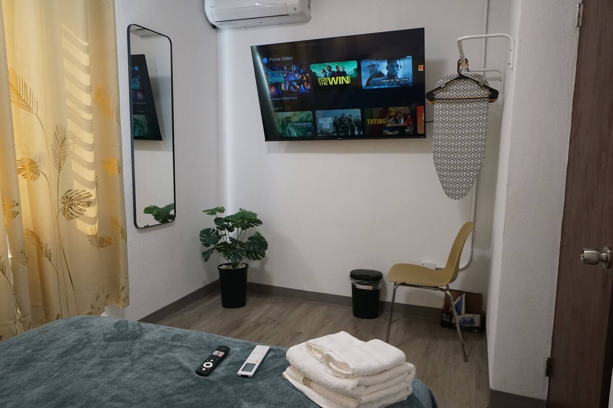 Premium bedding, memory foam beds, desk, laptop workspace