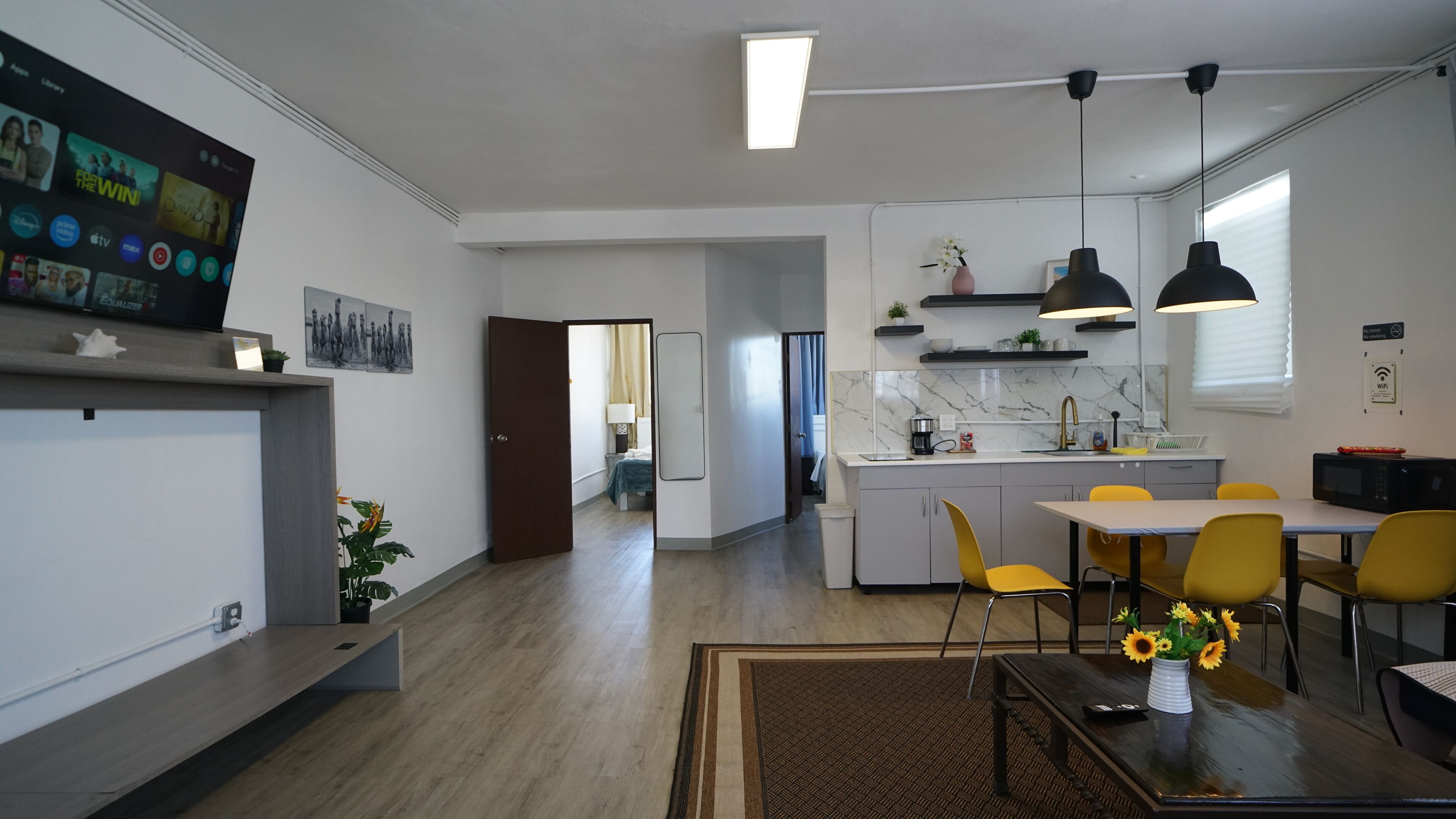 Grand Apartment | Living area | 58-inch TV with digital channels, Netflix, Hulu