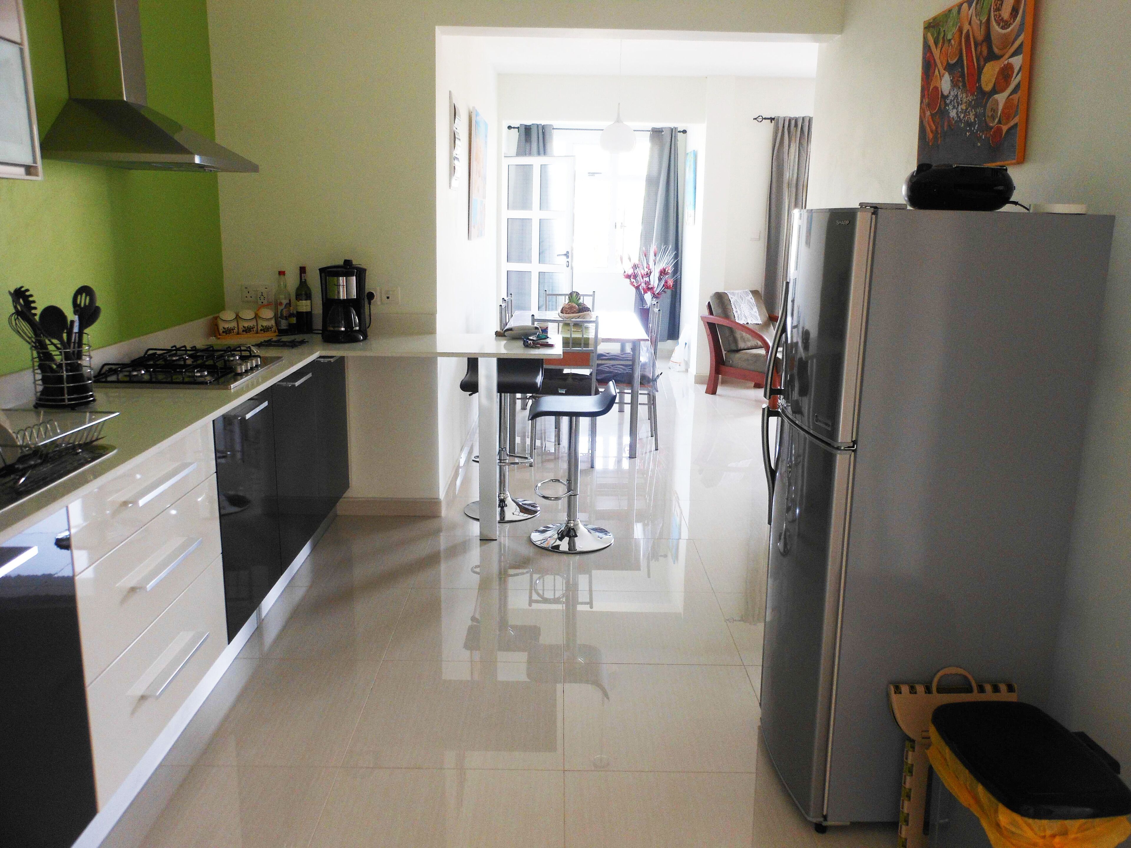 Apartment, 2 Bedrooms, Balcony, Pool View | Private kitchen | Coffee/tea maker, electric kettle, dining tables