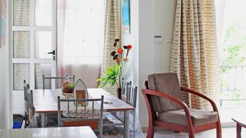 Apartment, 2 Bedrooms, Balcony, Pool View | Living area | 48-cm flat-screen TV with cable channels, DVD player