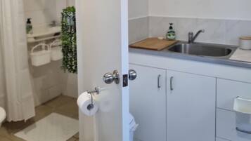 Shower, towels, soap, toilet paper