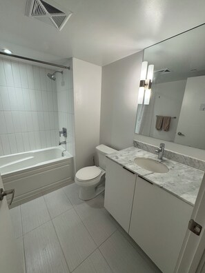Hair dryer, towels, soap, toilet paper