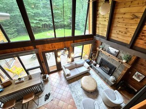 Smart TV, fireplace, table football, books