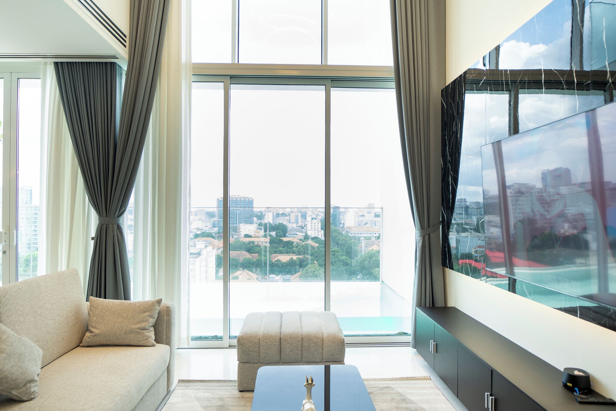 Luxury Apartment | Living area | 42-inch flat-screen TV with cable channels