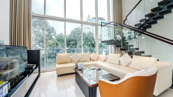 Design Apartment | Living area | 42-inch flat-screen TV with cable channels