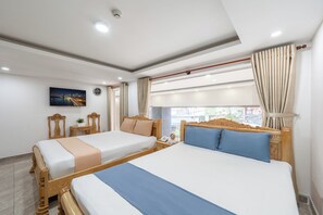 Family Twin Room, City View | Desk, free WiFi - Cozrum - New Sun Hotel (Ho Chi Minh)